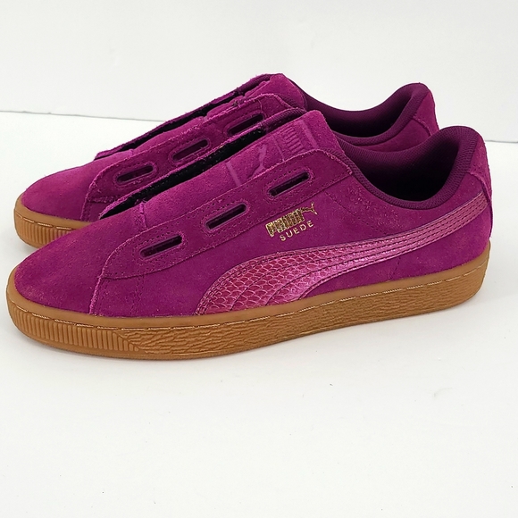 purple and gold suede pumas